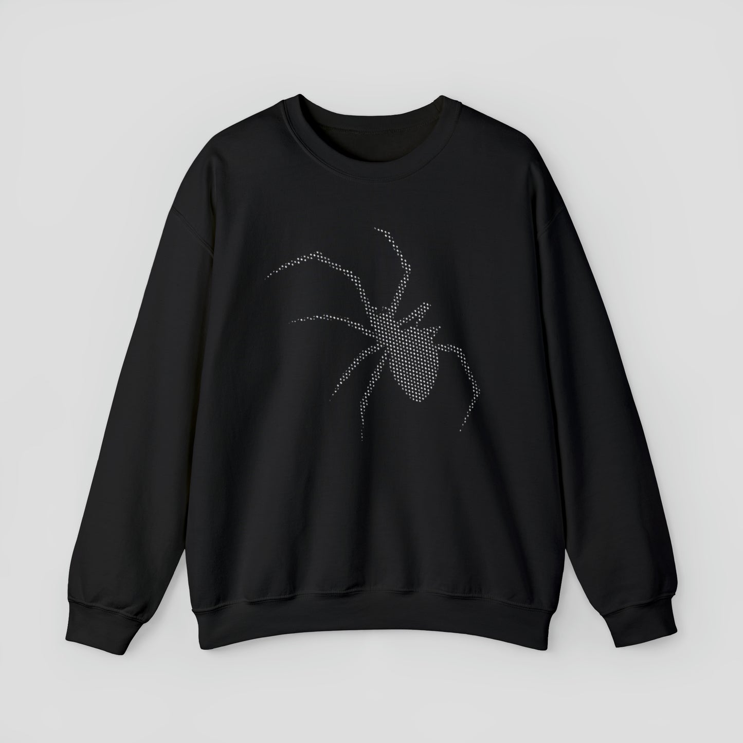 Front view of black sweatshirt with large white digitized image of a spider in center, against a gray background.
