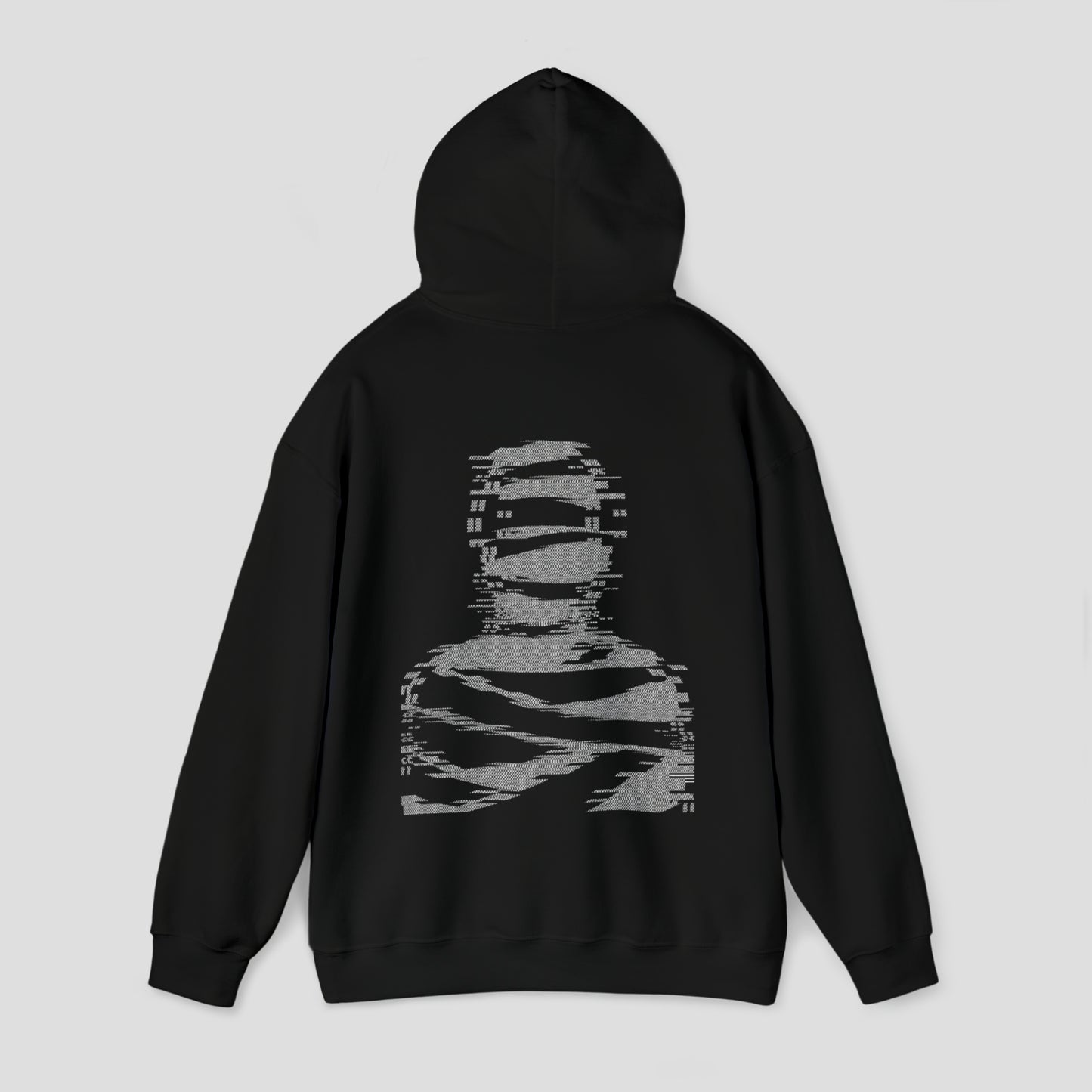 Back view of black hooded sweatshirt with hood up and large white digitized image of a mummy in center, against a gray background.