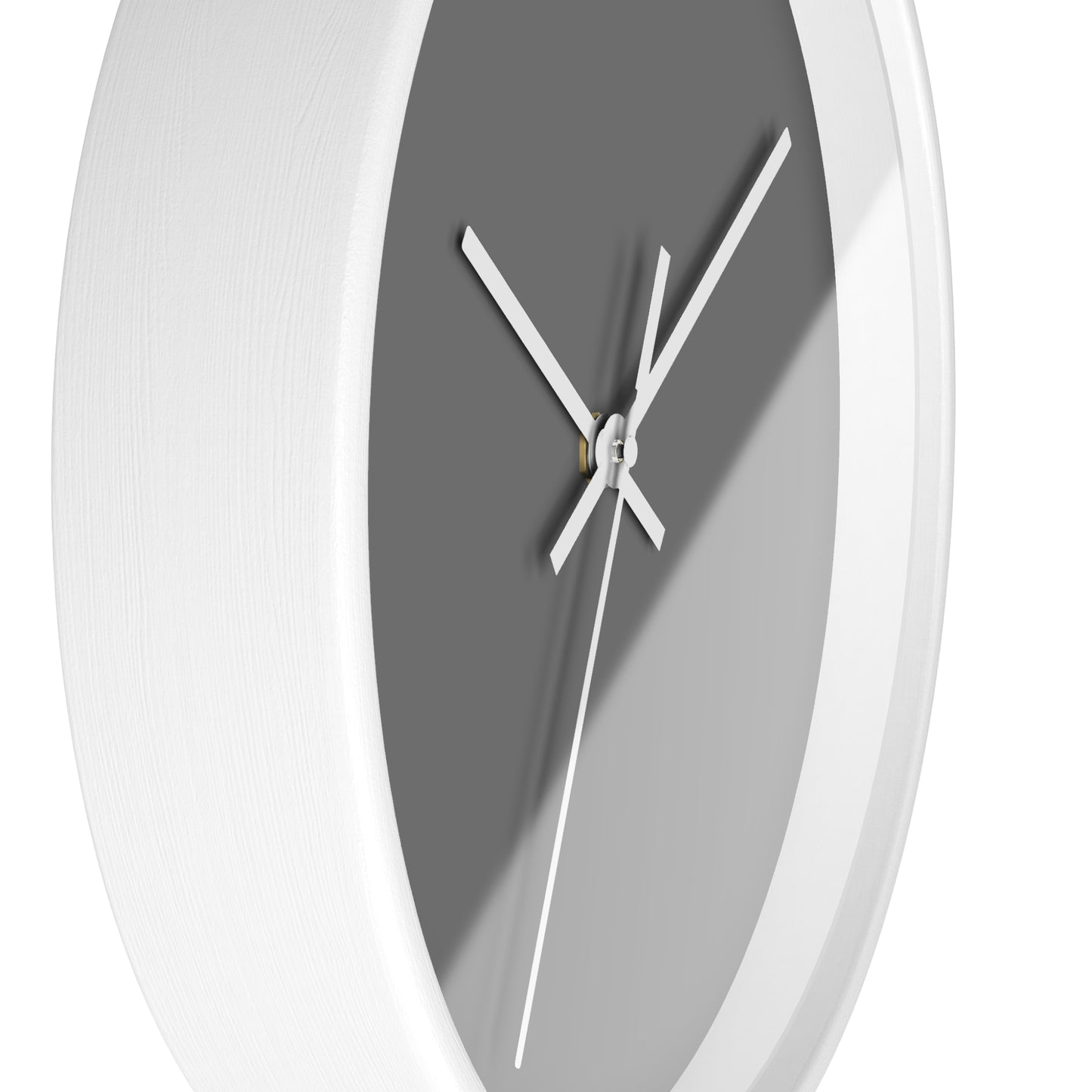 Side view of white circular wooden framed clock with tan background and white hands against a white background.
