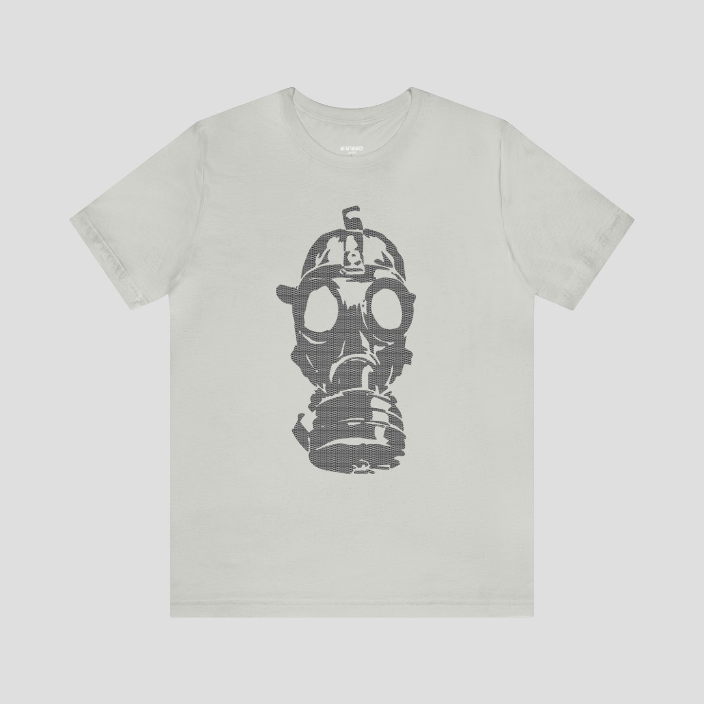 Silver t-shirt with a large gray image of a gas mask in center, against a gray background.