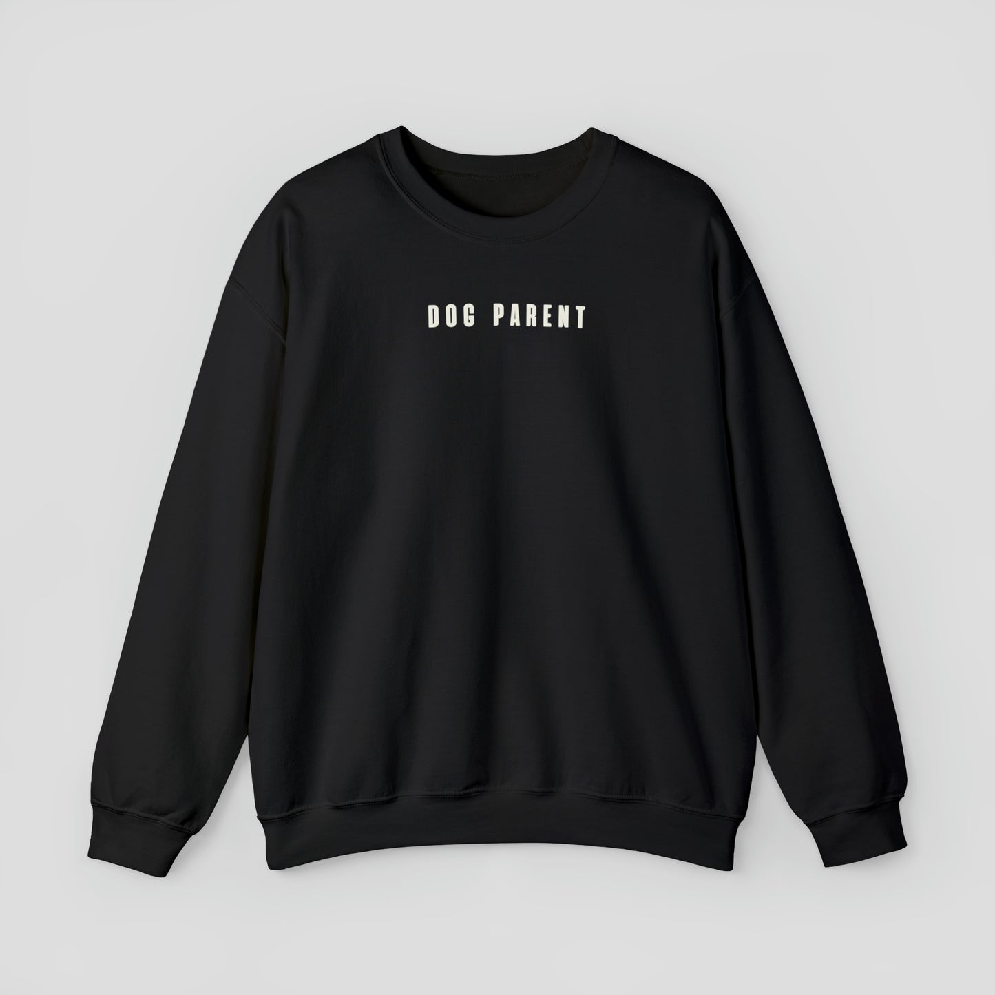 Black sweatshirt with "Dog Parent" in small white letters against light gray background.