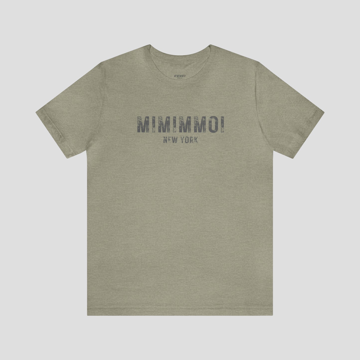 Gray t-shirt with the words Mimimmoi New York in distressed gray block letters across the chest, against a gray background.
