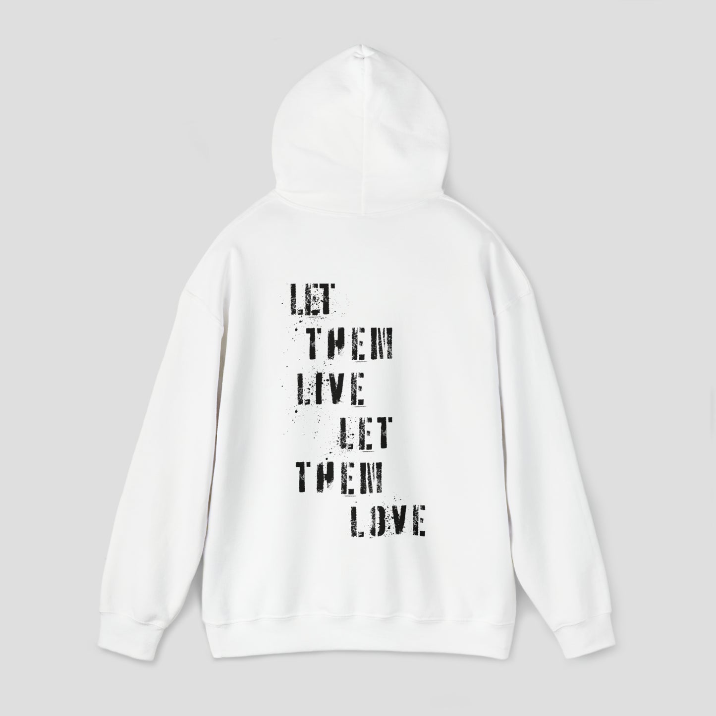 Back view of white hooded sweatshirt with hood up with the words Let Them Live Let Them Love in black spray-paint stenciled font in center, against a gray background.