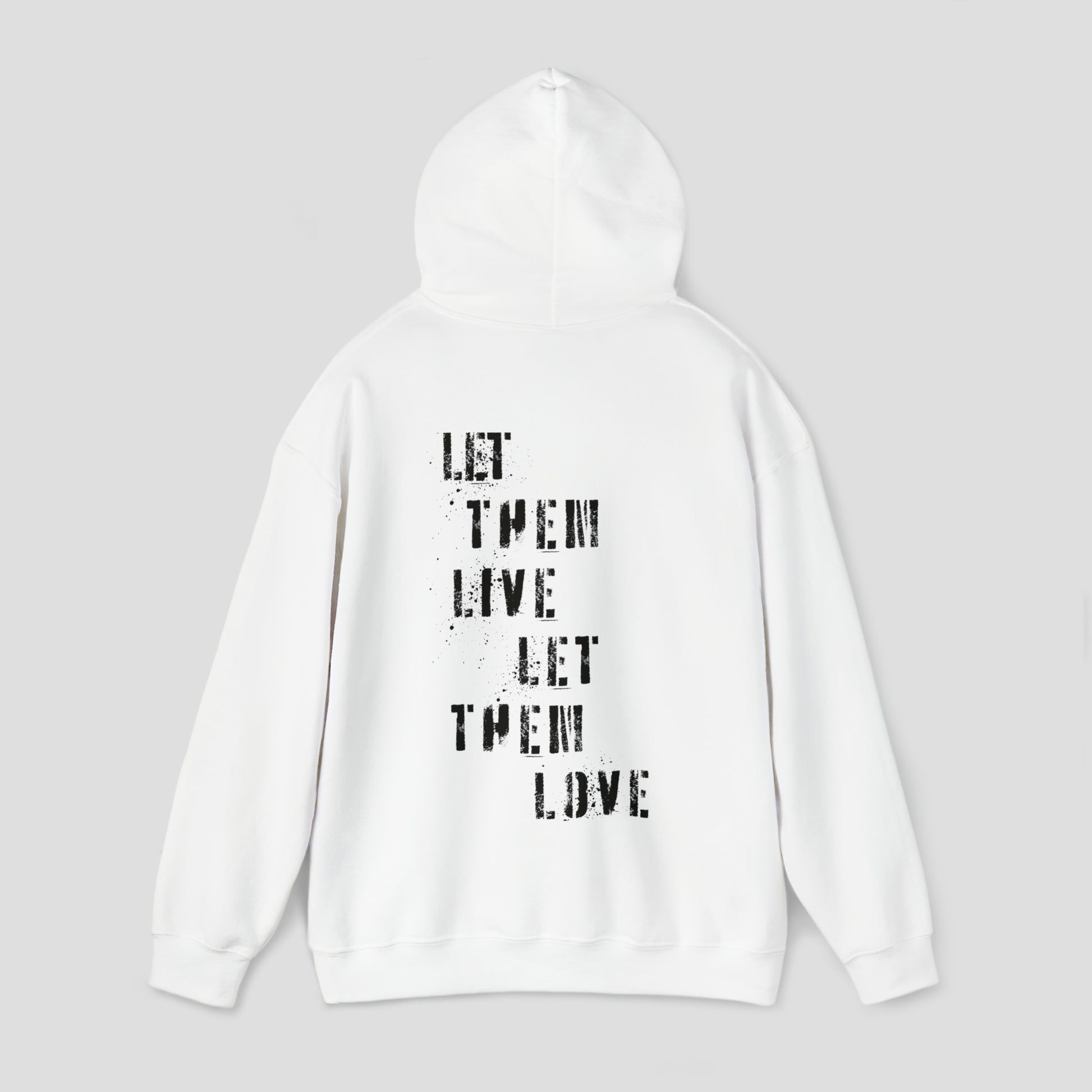 Back view of white hooded sweatshirt with hood up with the words Let Them Live Let Them Love in black spray-paint stenciled font in center, against a gray background.