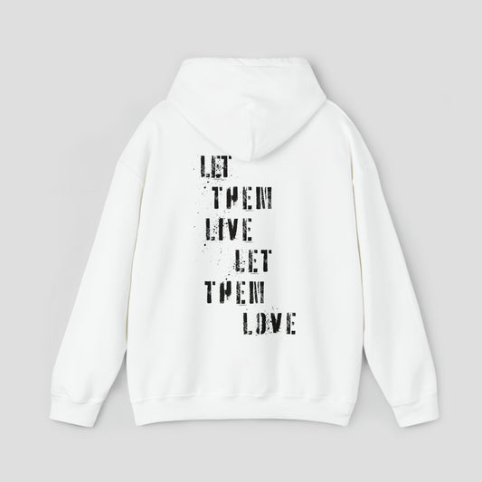 Back view of white hooded sweatshirt with hood down with the words Let Them Live Let Them Love in black spray-paint stenciled font in center, against a gray background.