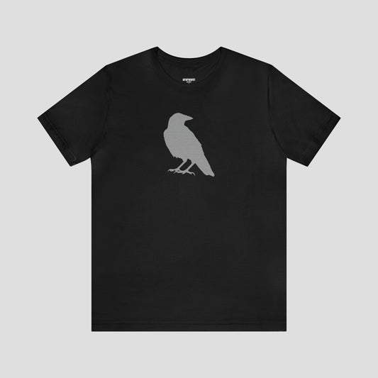 Black t-shirt with large multi-lined silhouette of a raven across the chest, against a gray background.