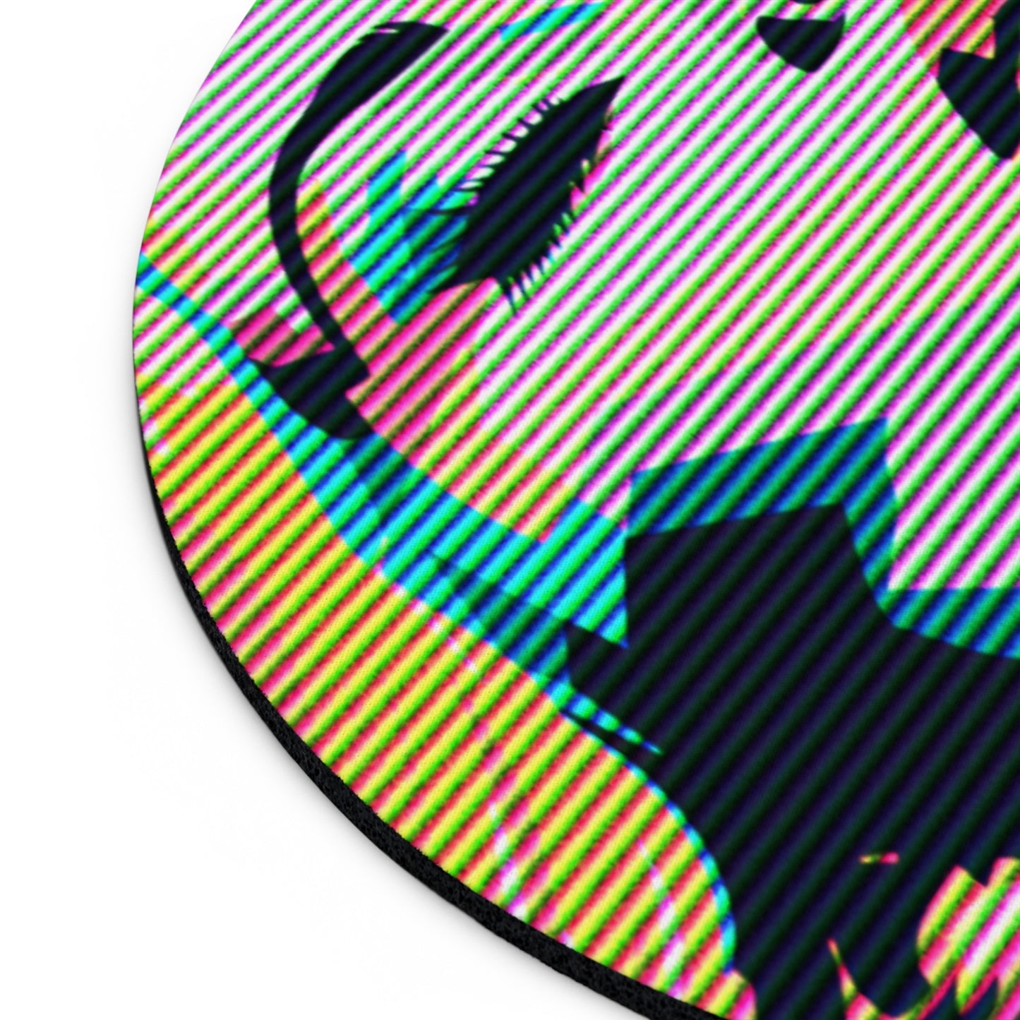 Close up tilted view of round mousepad with colorful pop art illustration of blonde woman's face with eyes closed, against a white background.