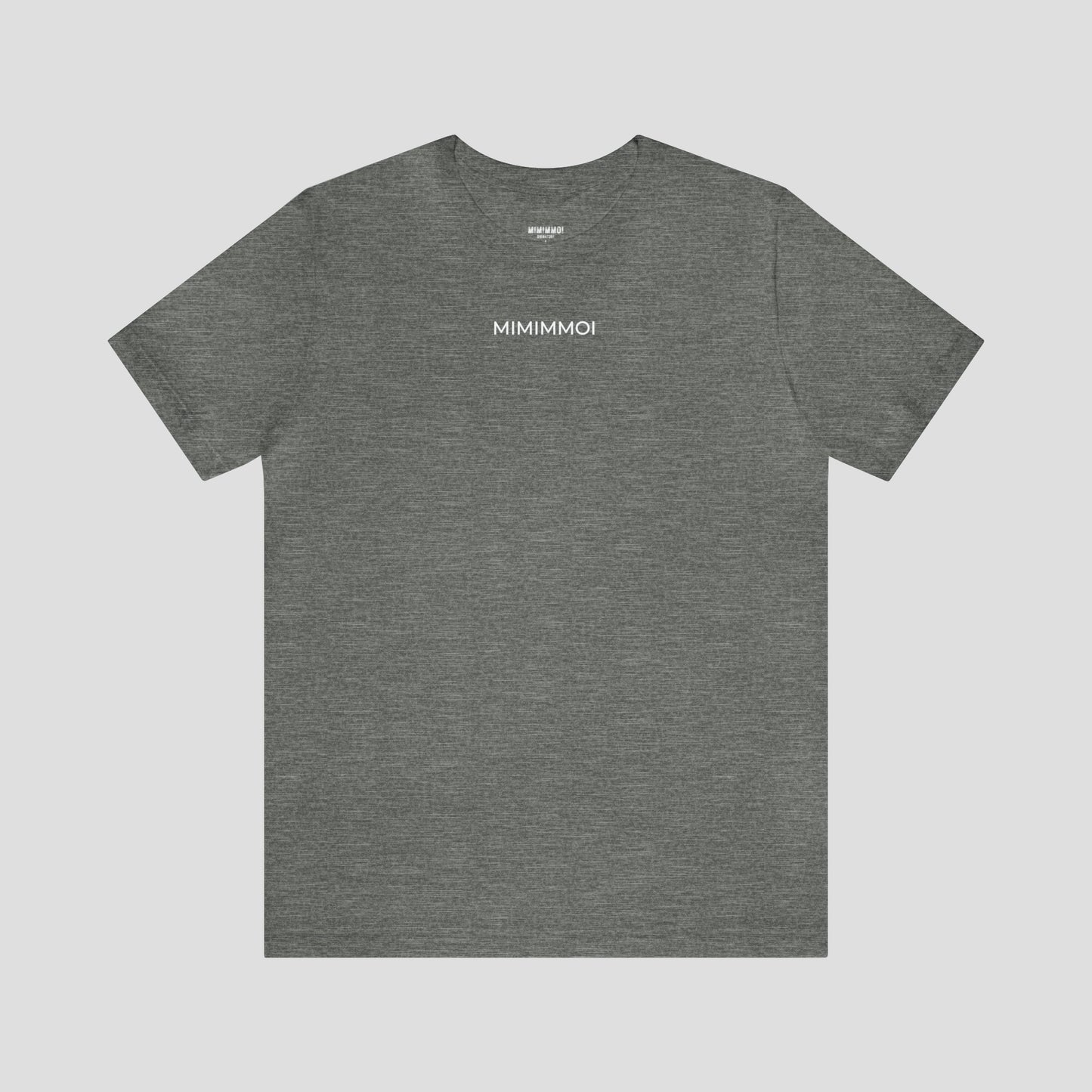 Gray t-shirt with the word "Mimimmoi" in small white letters a few inches under the neckline, against a gray background.