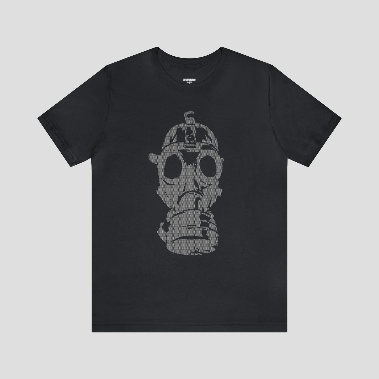 Vintage black t-shirt with a large gray image of a gas mask in center, against a gray background.