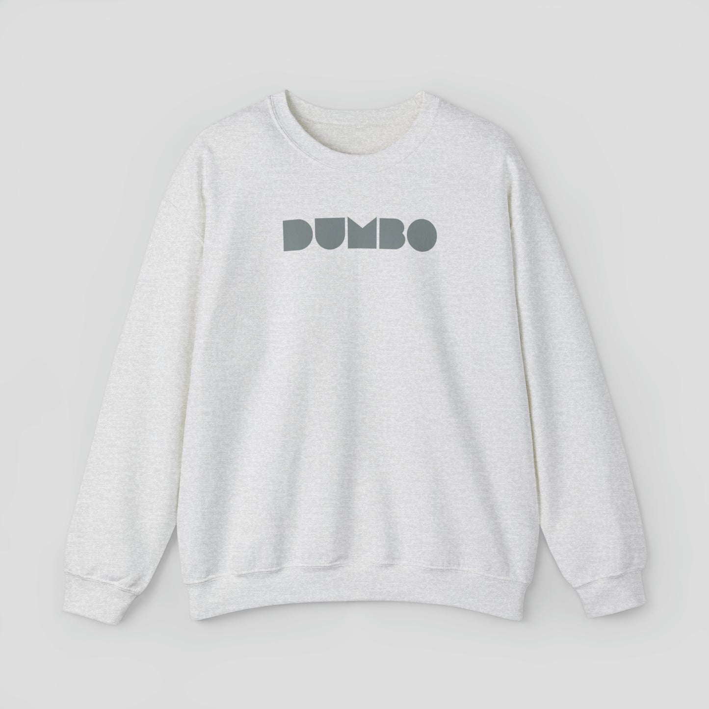 Light gray sweatshirt with the word Dumbo in gray block letters across the chest, against a gray background.
